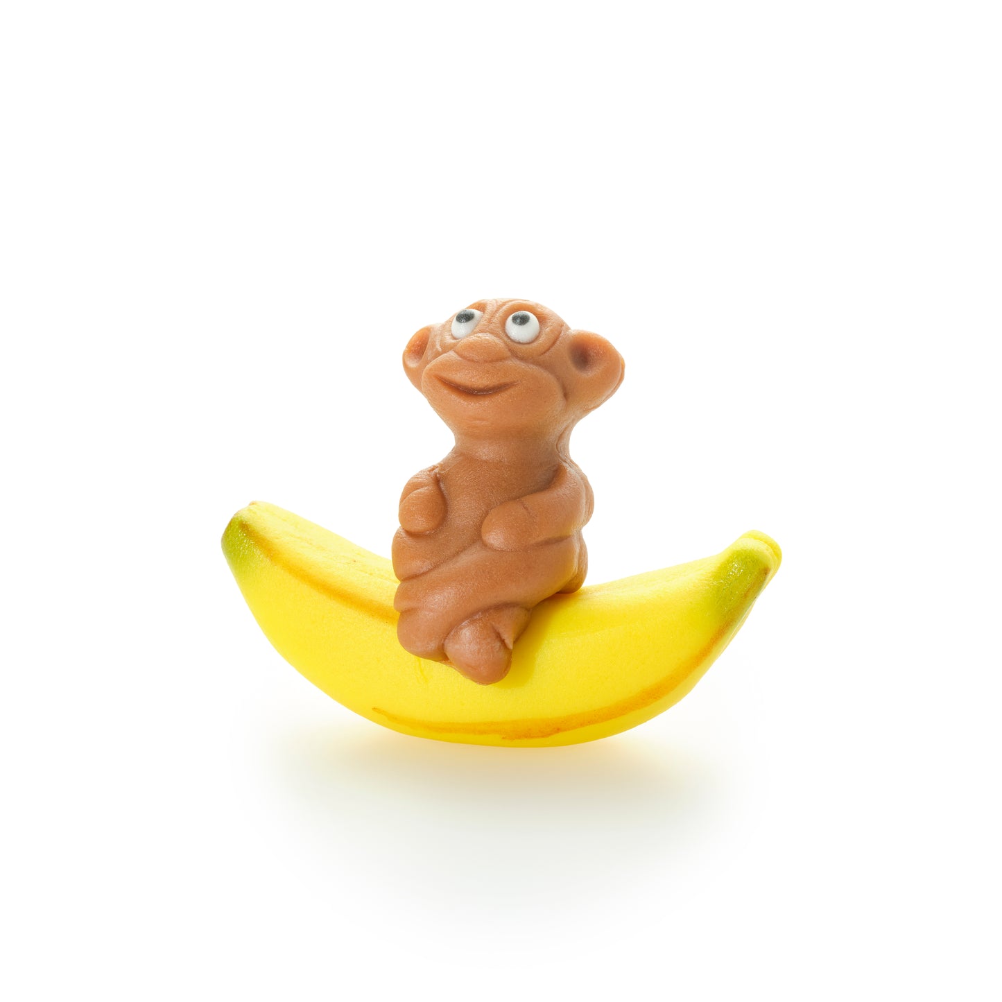 Affe sitzend auf Banane