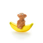 Affe sitzend auf Banane